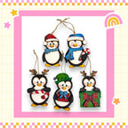 A group of five colorful penguin ornaments hanging from a string, each with unique accessories such as hats, scarves, and presents.