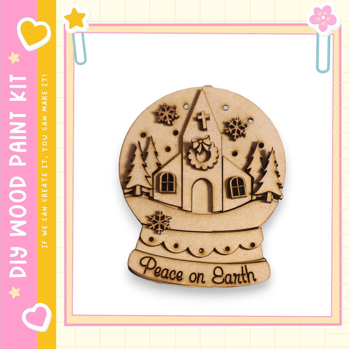 A wooden snow globe with a church and snowflakes, along with the text "Peace on Earth" on the base.