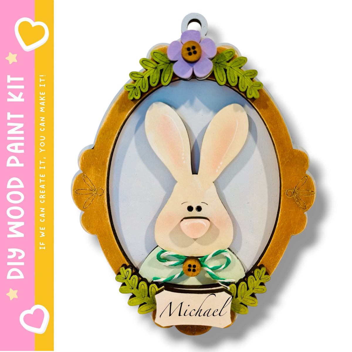 a wooden frame with a painted rabbit on it, surrounded by decorative leaves and flowers.