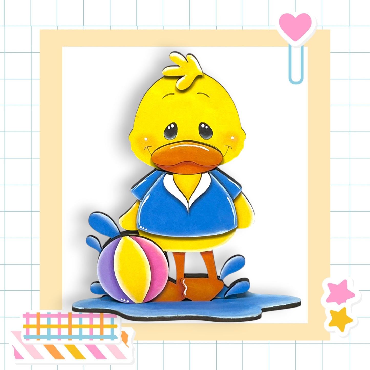 a picture of a rubber ducky with a blue shirt