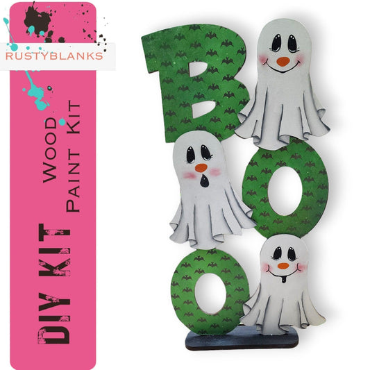 a paper cut out of the letter b and three ghostes