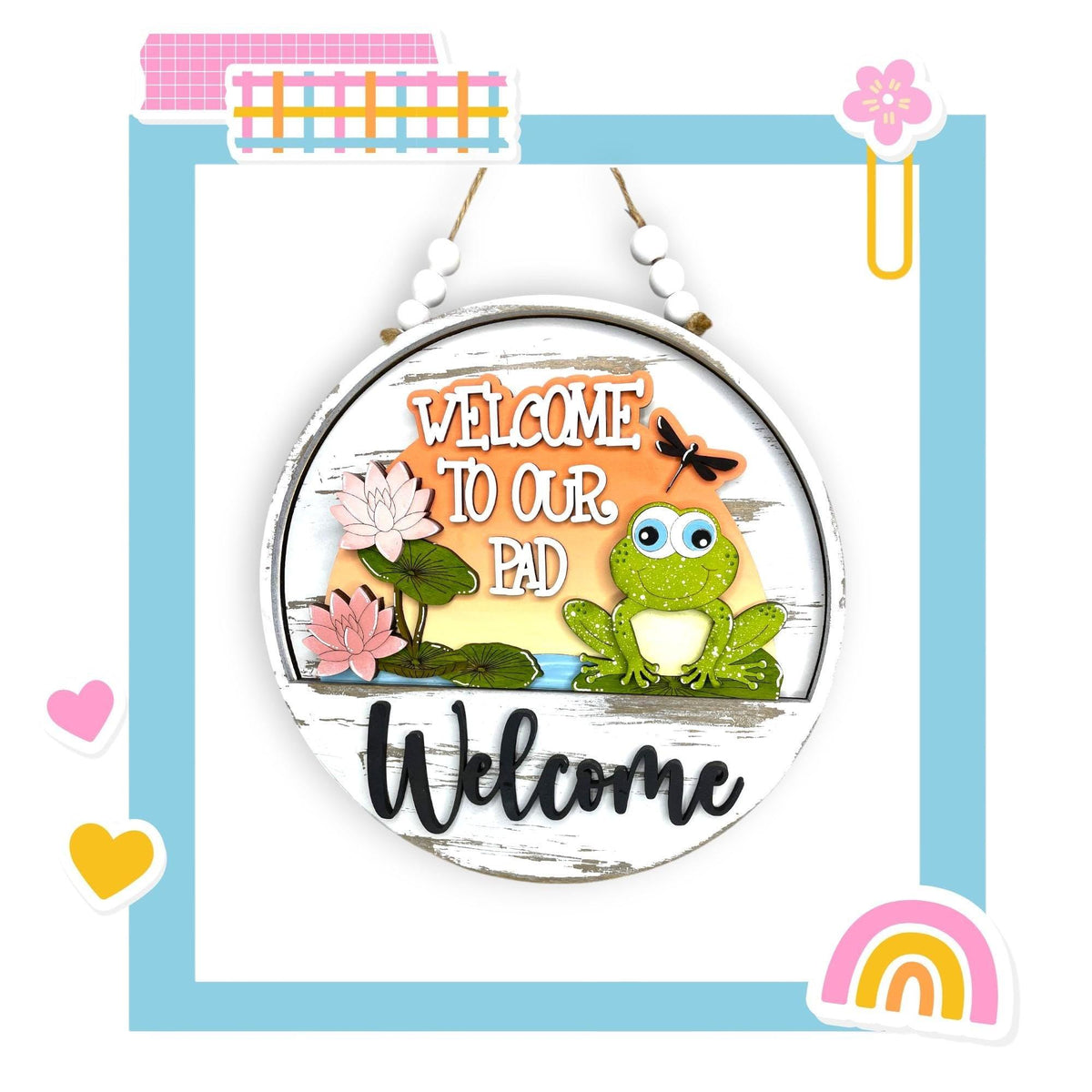 a welcome sign hanging on a wall