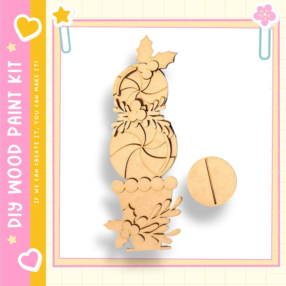 a wooden craft kit with a decorative piece, likely a snowflake or ornament, and a small circular object, possibly a paintbrush or tool, on a white background.