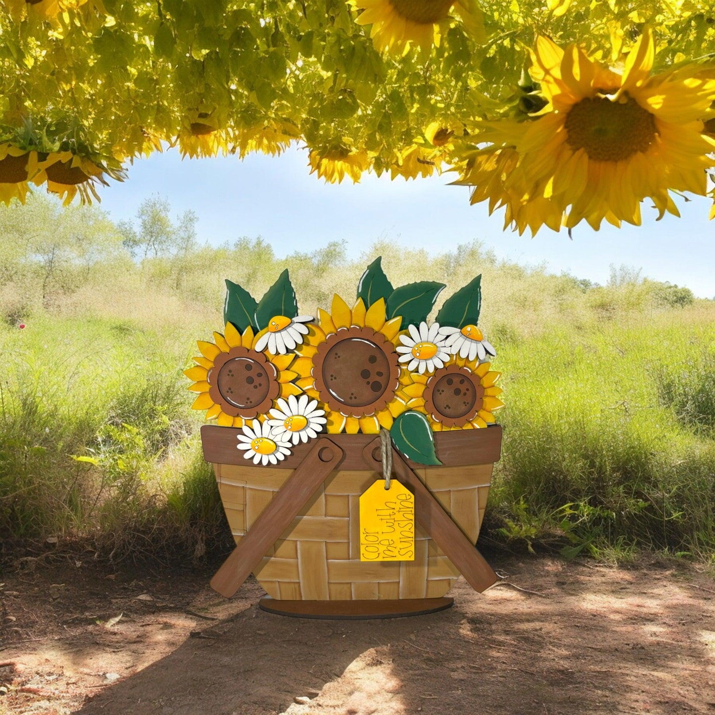 a basket of sunflowers is sitting under a tree