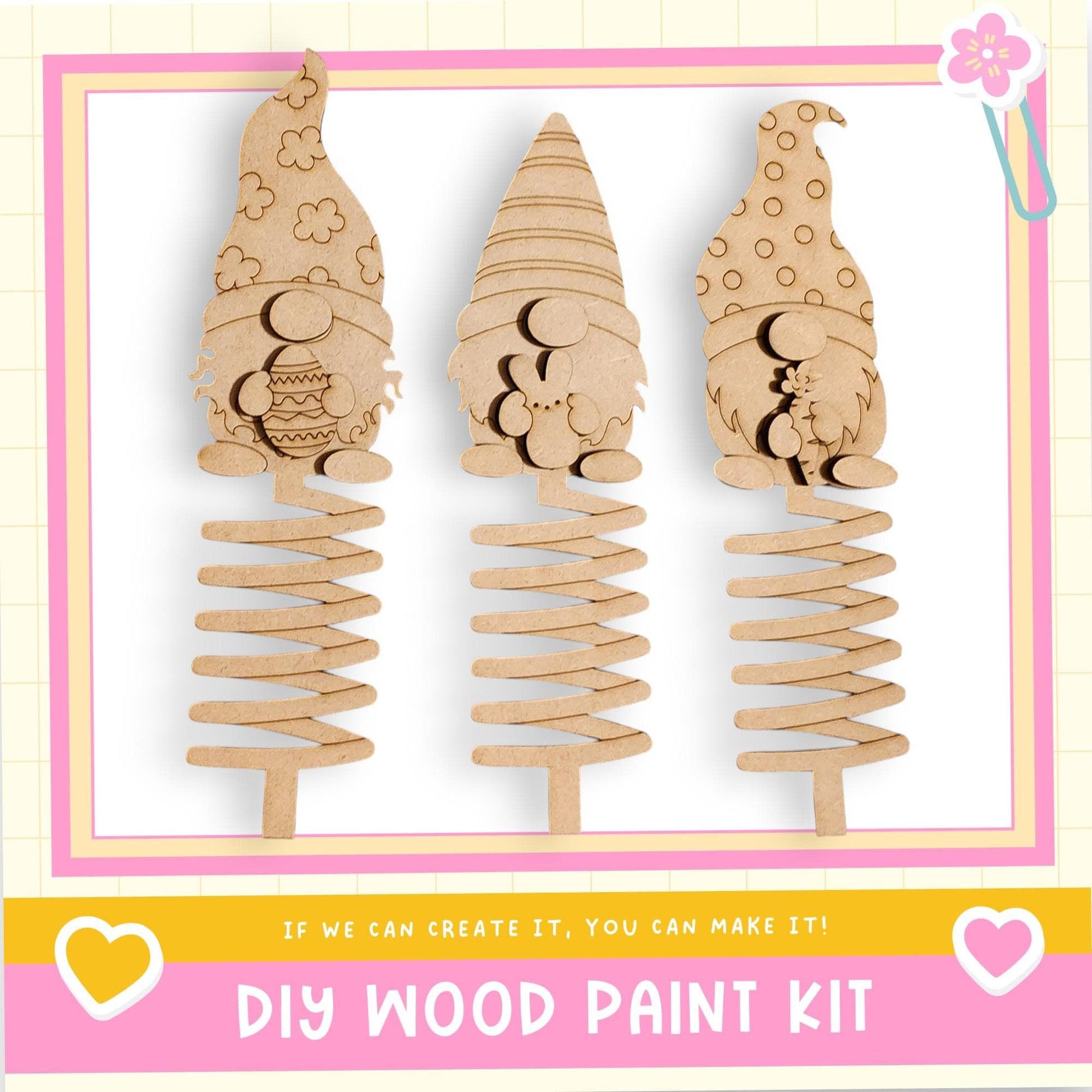 three wooden gnome-shaped ornaments, each with a unique design, displayed against a white background.