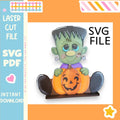 A Halloween-themed illustration of a green-skinned, green-eyed monster holding a carved pumpkin.