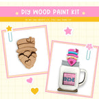 a picture of a wooden craft kit with a mug and a cookie