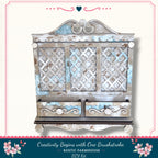 a rustic farmhouse-style wooden cabinet with a decorative lattice design and two drawers. The cabinet has a distressed, weathered appearance, suggesting it has been well-used and loved over time. The text "Creativity Begins with One Brushstroke. Rustic Farmhouse - DIY Kit" indicates that this cabinet is part of a DIY kit for creating a similar piece of furniture.