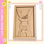 a wooden cutout of a rabbit wearing a top hat and bowtie, which is displayed in a frame.
