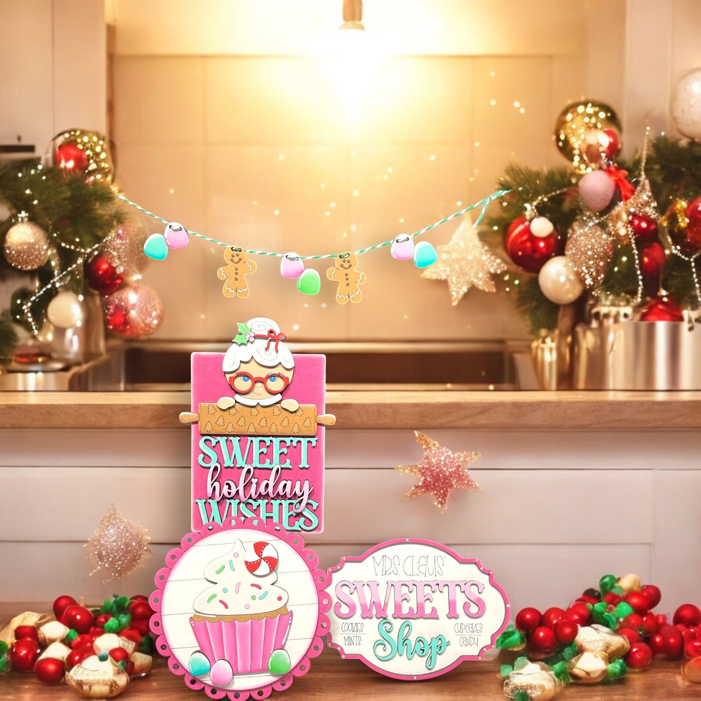 a table topped with lots of cupcakes and christmas decorations