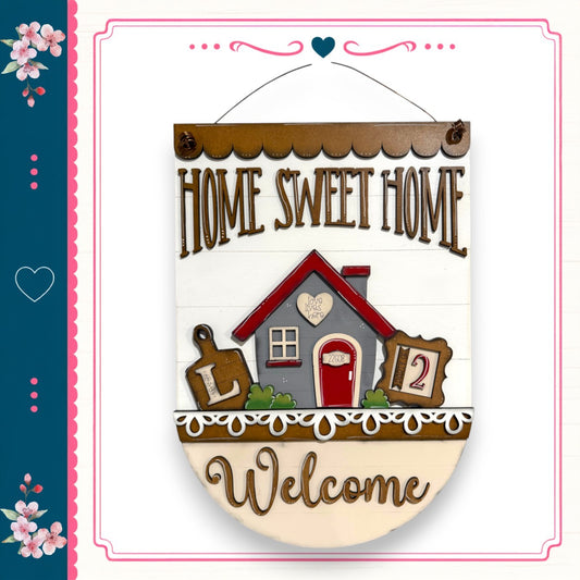A wooden sign with the text "HOME SWEET HOME" and a house illustration, along with the number "2" and the word "Welcome" below it.