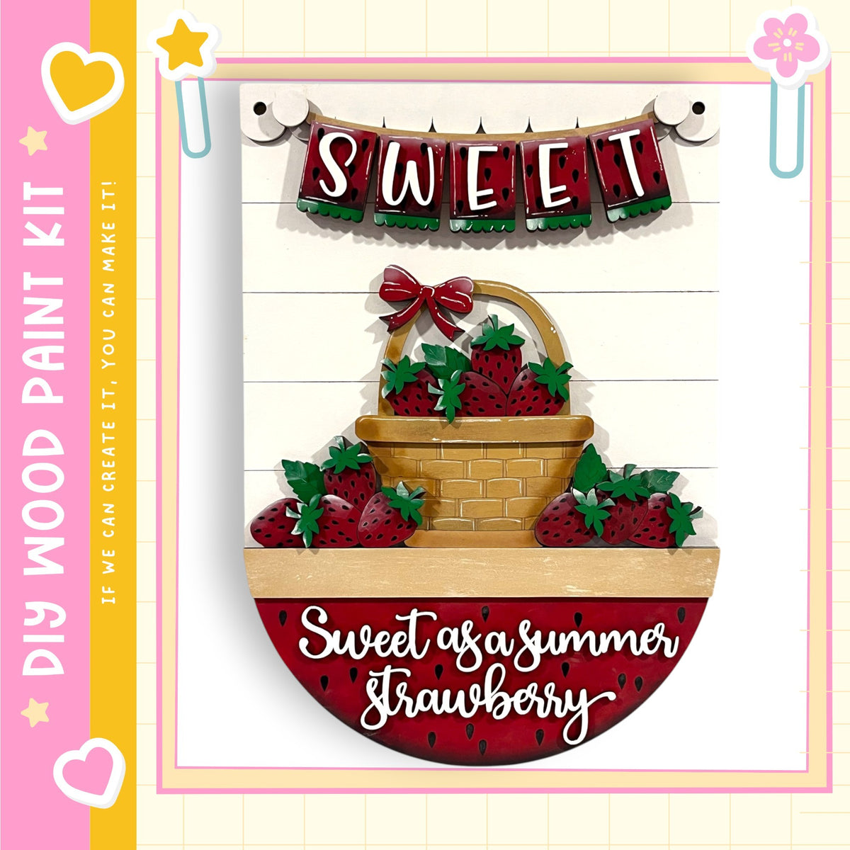 The image is a decorative piece featuring a basket filled with red strawberries, with the word "Sweet" written above it. The basket is placed on a wooden surface, and the background is white with a pink border.