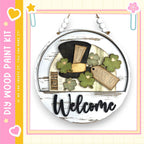 A wooden sign with a welcome message, surrounded by various decorative elements such as clovers and a star.