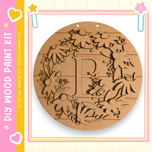 a round wooden wreath with a letter "P" carved into it.