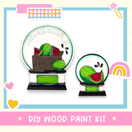 a DIY wood paint kit for creating a wooden snow globe with a watermelon design.