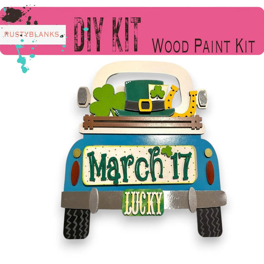 a blue truck with a green hat on top of it