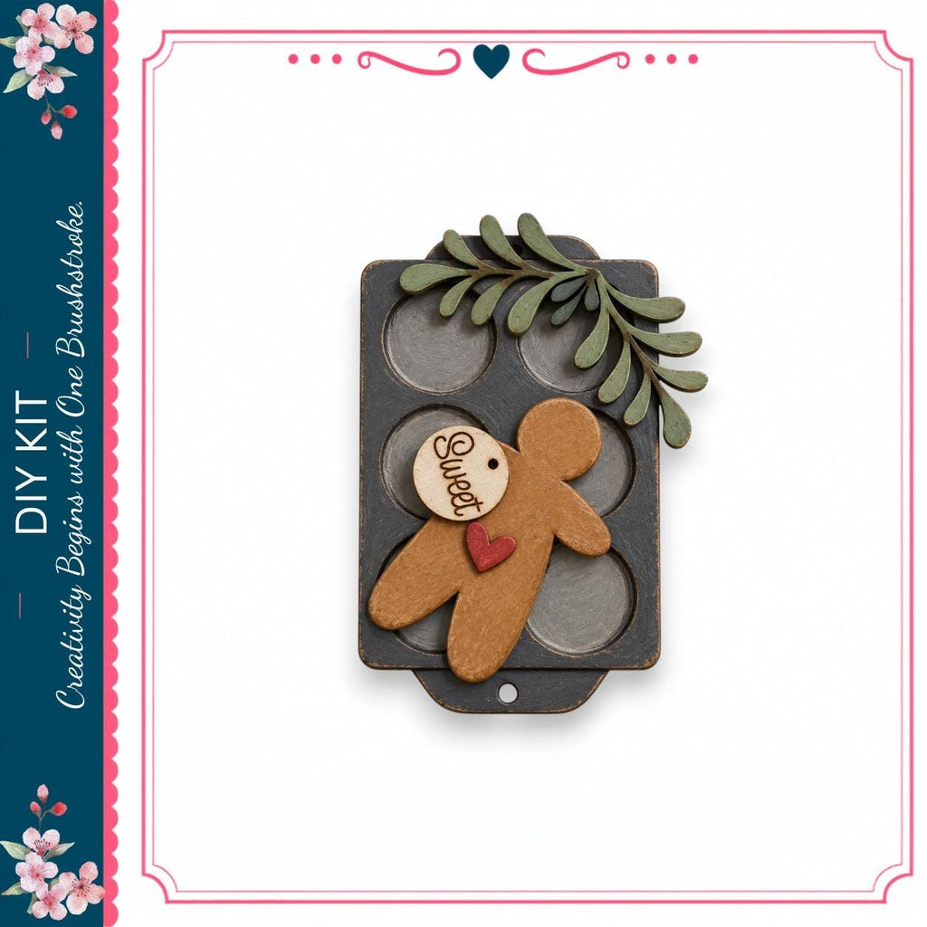 a wooden gingerbread man figure with a heart tag, placed on a black tray with a leaf decoration.