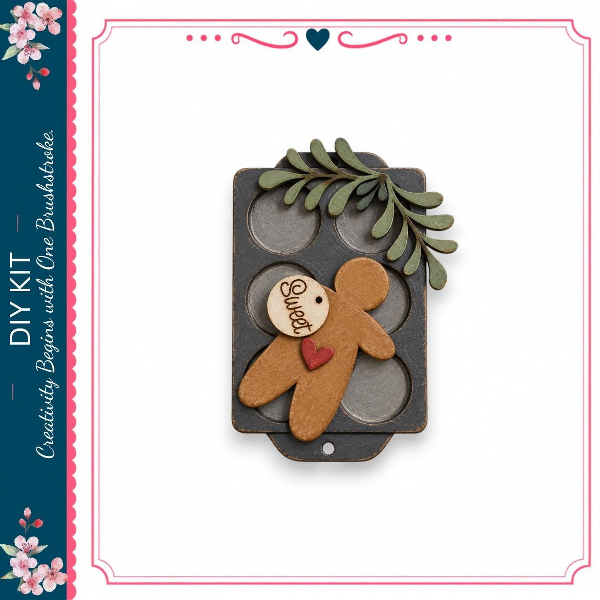 a wooden gingerbread man figure with a heart tag, placed on a black tray with a leaf decoration.