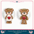two teddy bears with angelic wings, one brown and one white, both with hearts on their chests.