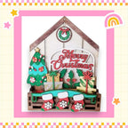 a christmas card with a house and stockings