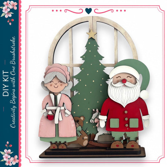 A DIY kit featuring a Christmas tree, Santa Claus, and a teddy bear, with a decorative border and floral elements.