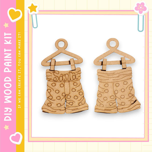 two wooden shorts hanging on a hanger, with a pink and yellow border.