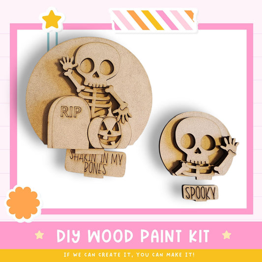 a DIY wood paint kit for creating Halloween decorations, including a skeleton and a skull. The kit appears to be made of wood and is designed for painting.
