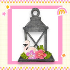 a card with a flamingo in a lantern