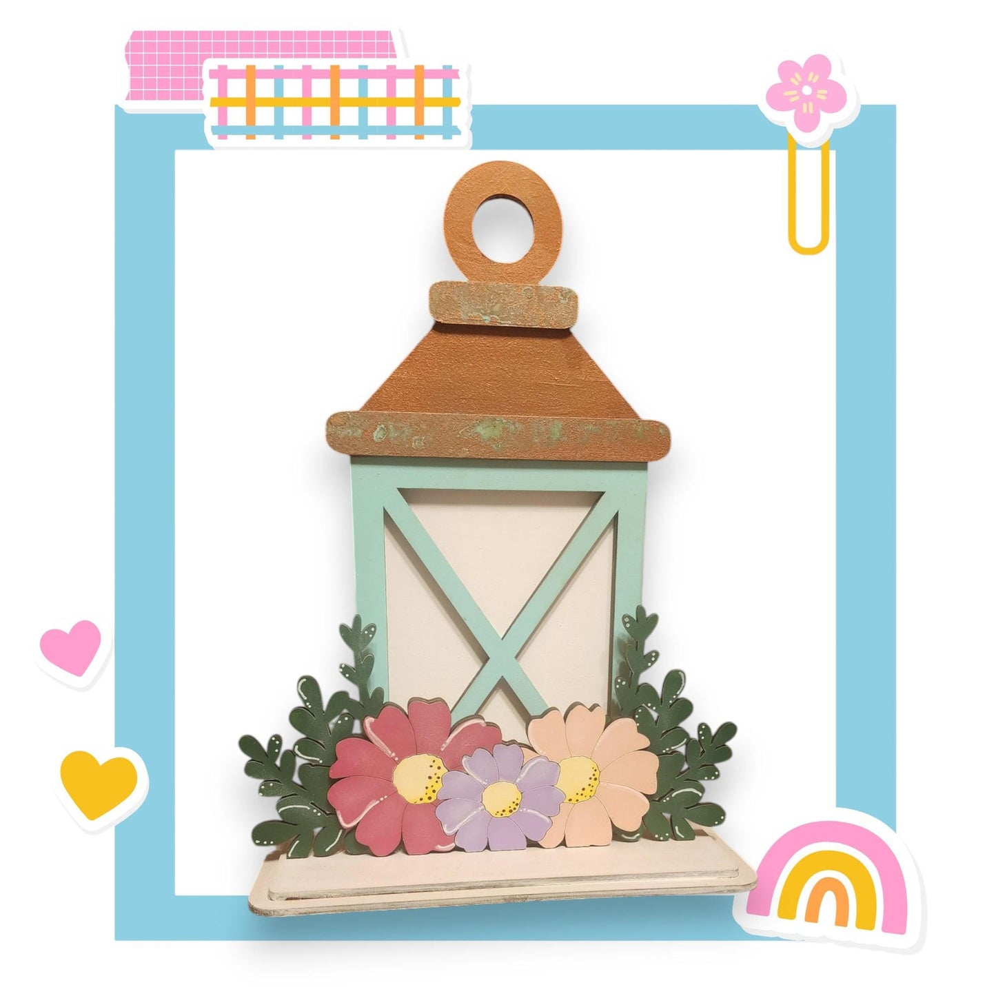 a wooden lantern with flowers and a rainbow in the background