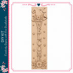 a wooden welcome sign with the word "WELCOME" carved into it. The sign is decorated with flowers and stars, creating a festive and inviting atmosphere.