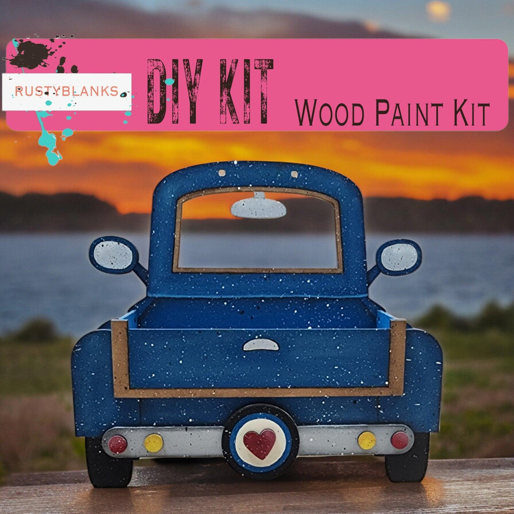 a blue toy truck sitting on top of a wooden table