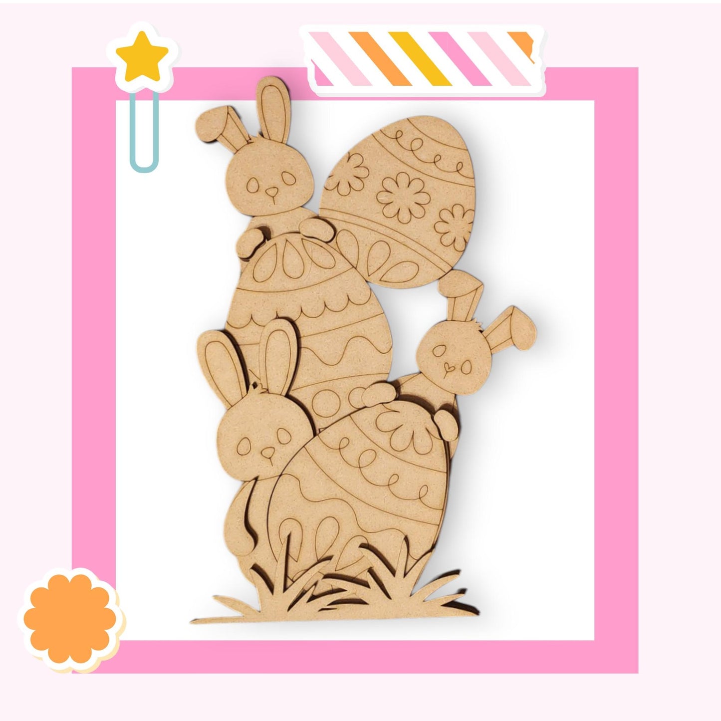 a wooden cutout of a bunny holding a baby