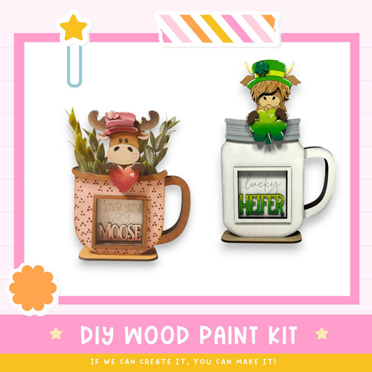 two mason jars with moose and leprechaun decorations, along with a DIY wood paint kit and a star-shaped icon.
