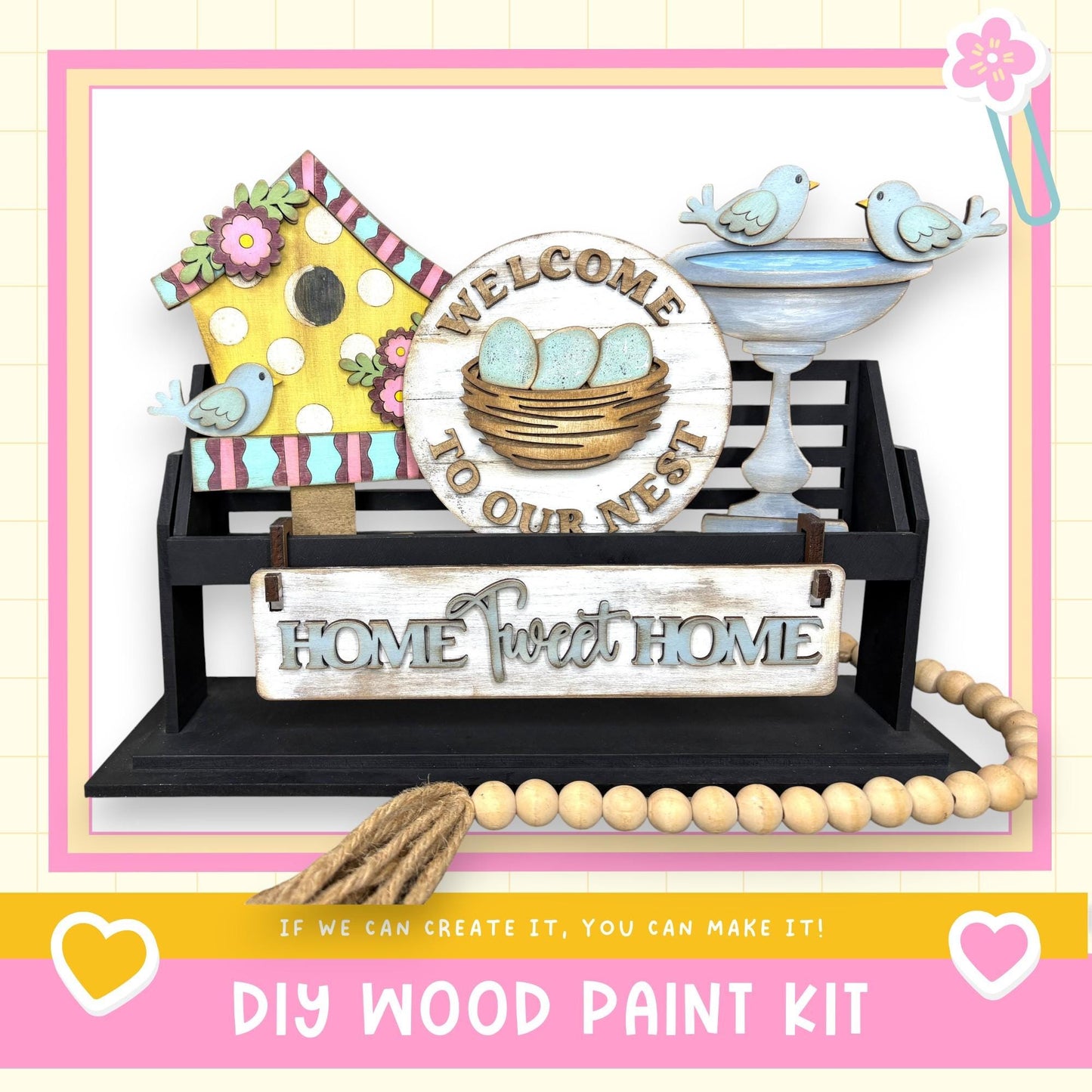 a DIY wood paint kit for creating a welcoming home, including a birdhouse, a sign, and a beaded string.