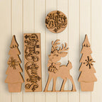 a collection of wooden cutouts, including a deer, trees, and a circular sign with the text "Merry & Bright".