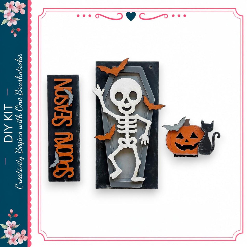 a skeleton figure, a carved pumpkin, and bats, all set against a black background.