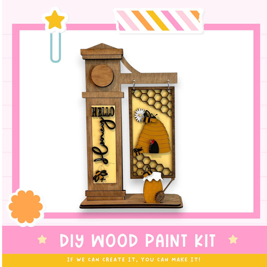 a picture of a wooden paint kit with a picture of a beehive