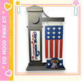 a DIY paint kit kit, which includes a wooden frame with an American flag design and a wooden plaque. The kit appears to be made of wood and is designed for creating a wooden frame with a painted American flag design.