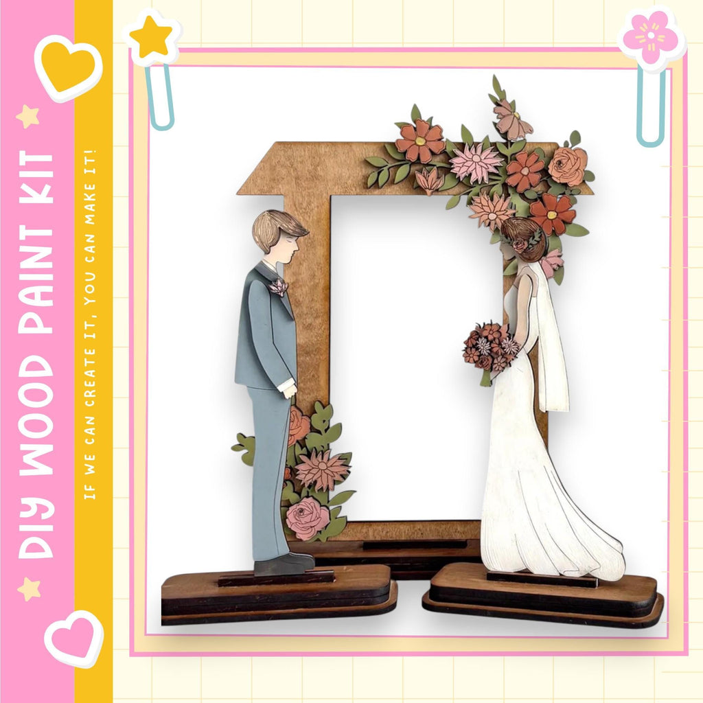 A wooden frame with a bride and groom figure inside, surrounded by flowers.