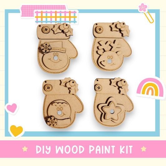 The image is a DIY wood paint kit featuring four wooden mittens with various designs, including stars, snowflakes, and hearts.