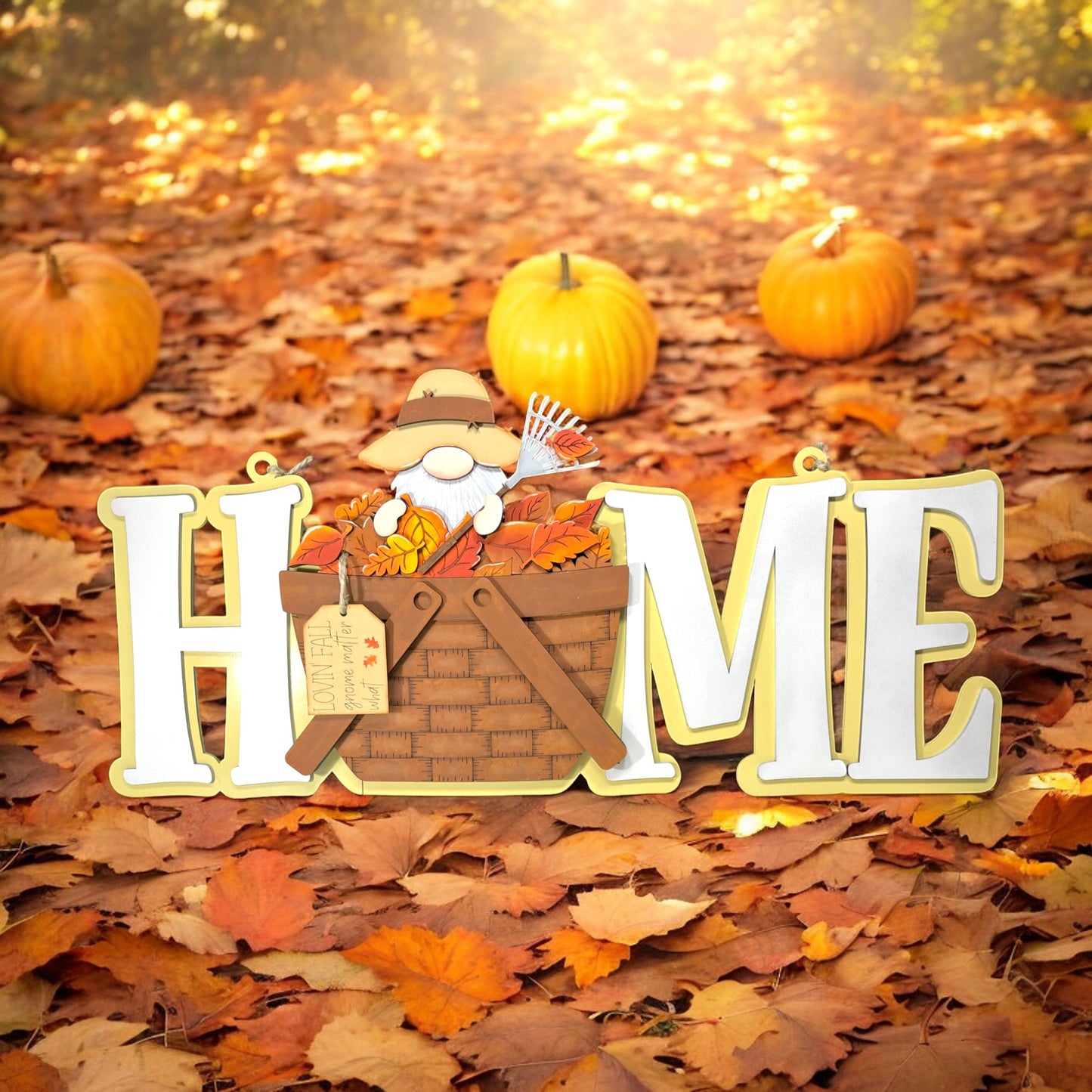 a sign that says home in front of some pumpkins