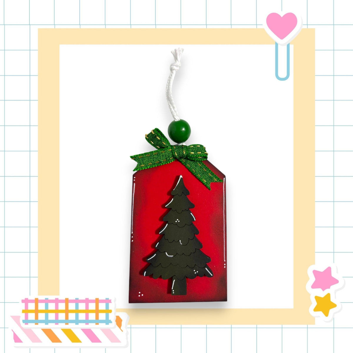 a christmas ornament with a tree on it