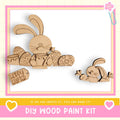 a DIY wood paint kit for creating Easter-themed decorations, including a wooden bunny and Easter eggs.