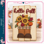 a wooden sign with the text "Hello Fall" and a decorative arrangement of sunflowers, pumpkins, and leaves.