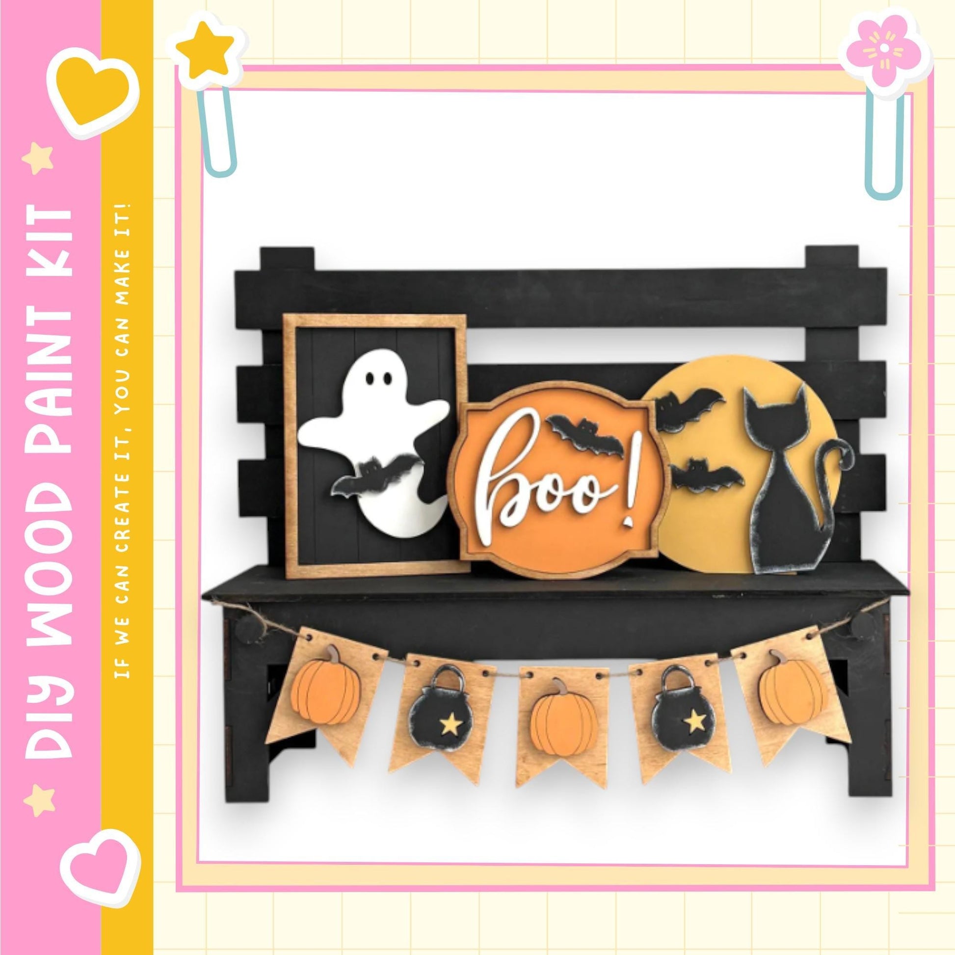 a Halloween-themed display with a black bench, a ghost, a cat, and a pumpkin. The bench has a sign that says "boo!" and a banner with pumpkins and bats hanging from it.