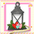 a picture of a lantern with hearts on it