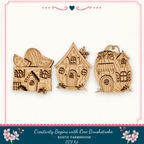three wooden houses, each with unique designs and decorations, arranged in a row.
