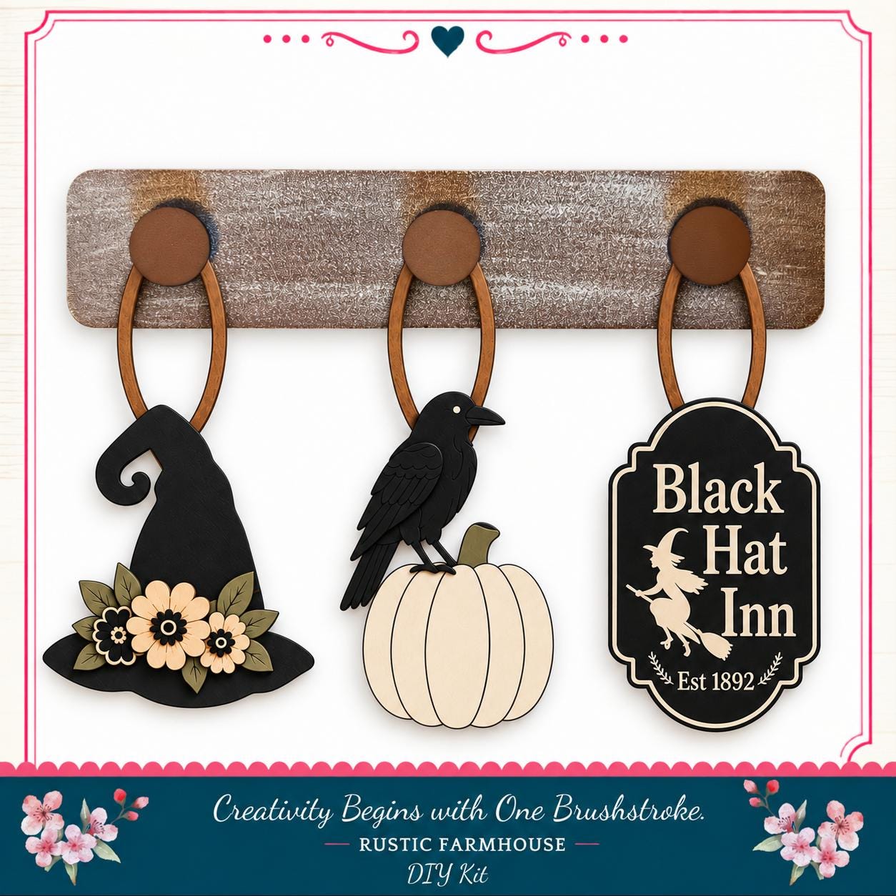 a rustic farmhouse-style DIY kit with three wooden wall hangings and a black witch's hat, a pumpkin, and a sign for the Black Hat Inn.