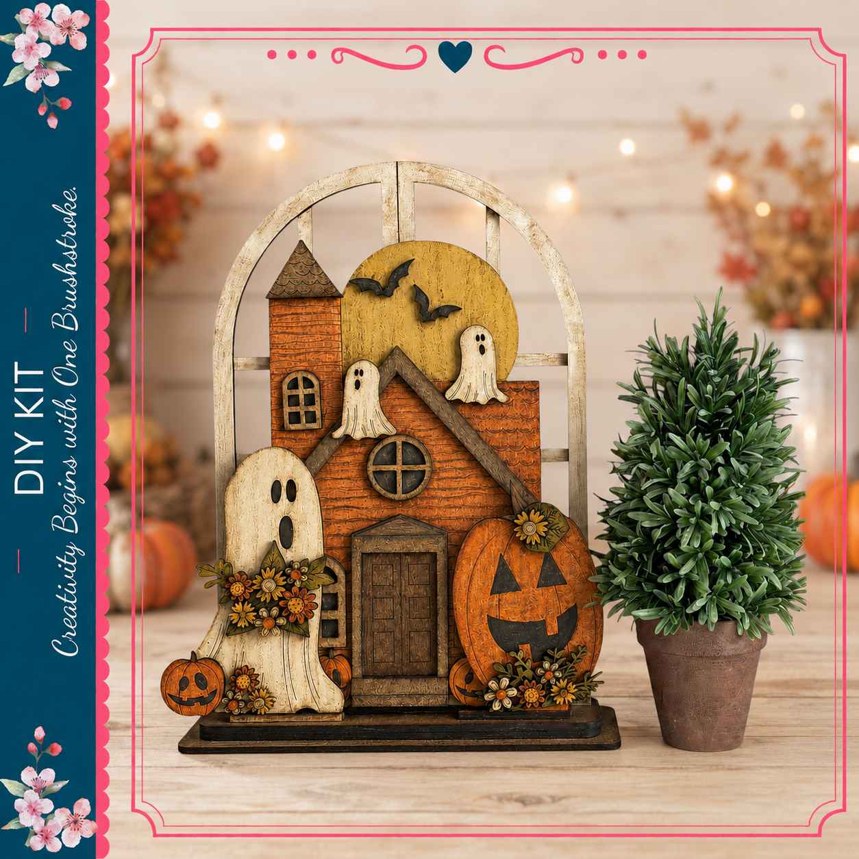 a Halloween-themed wooden house decoration with a carved pumpkin and ghost figures, placed on a wooden surface next to a potted plant.