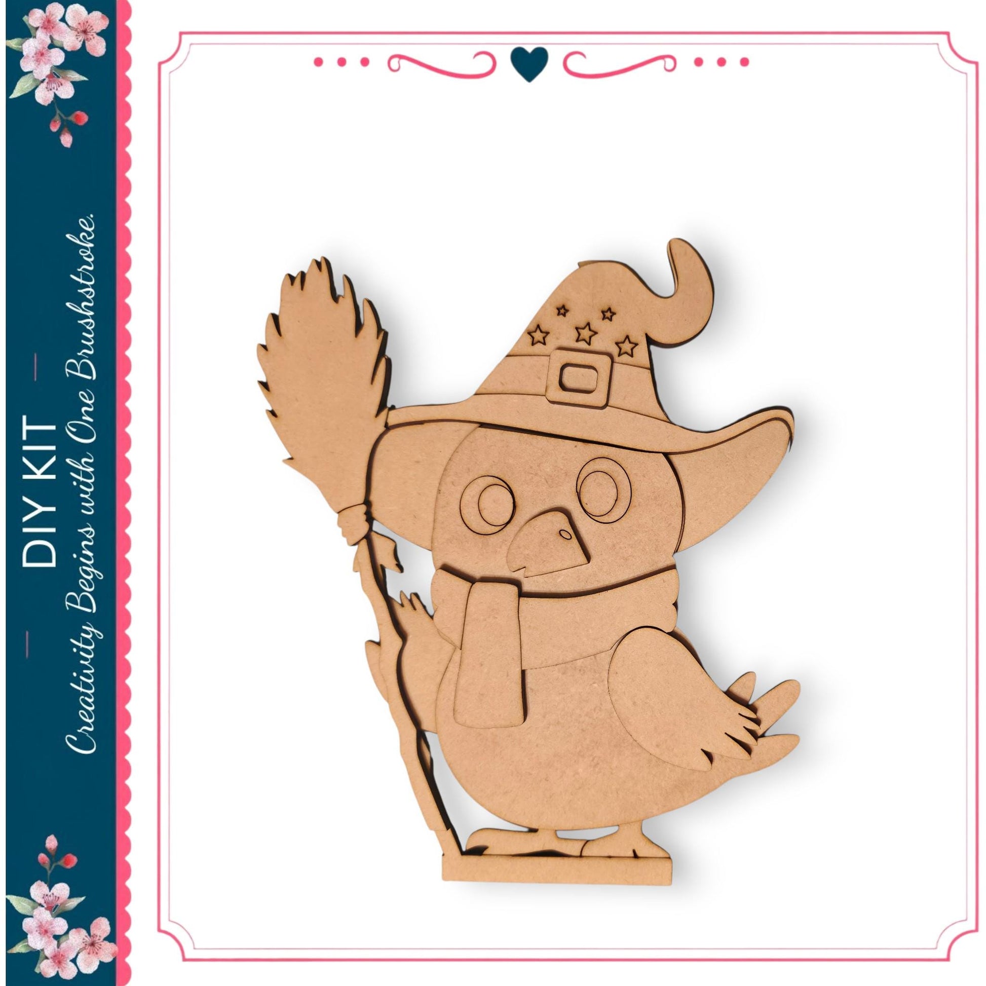 A wooden owl wearing a witch's hat and scarf, holding a broom, is depicted in the image.